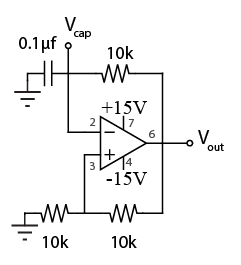 Operational amplifier relaxation oscillator with capacitor and Schmitt feedback